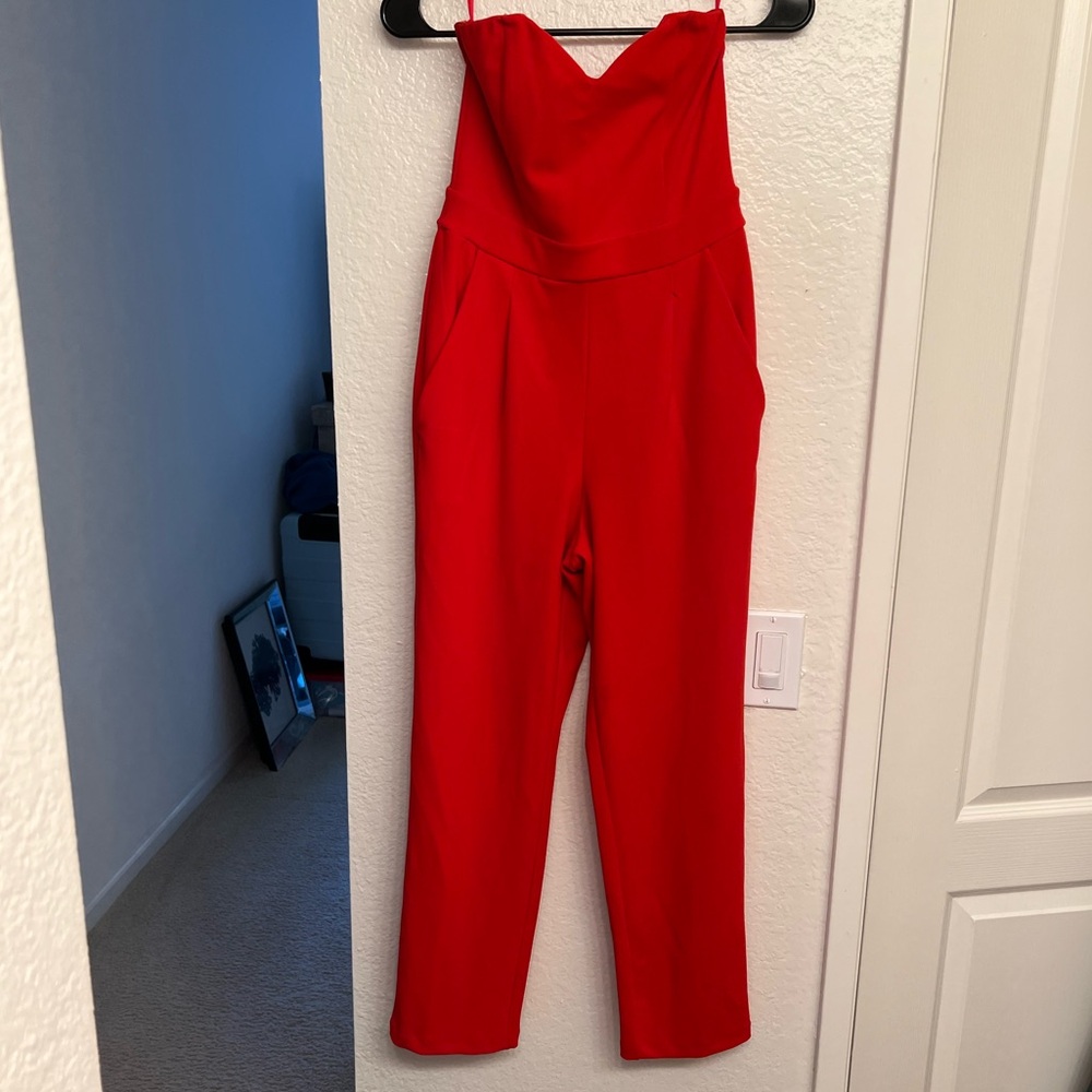 Red strapless jumpsuit with pockets